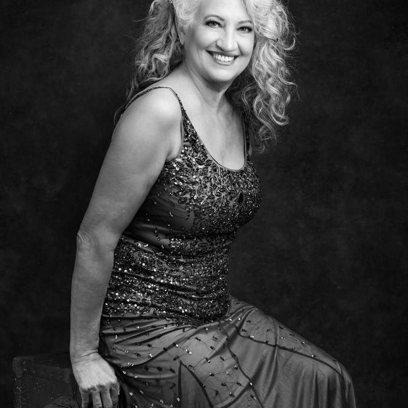 woman over 50 BW studio portrait
